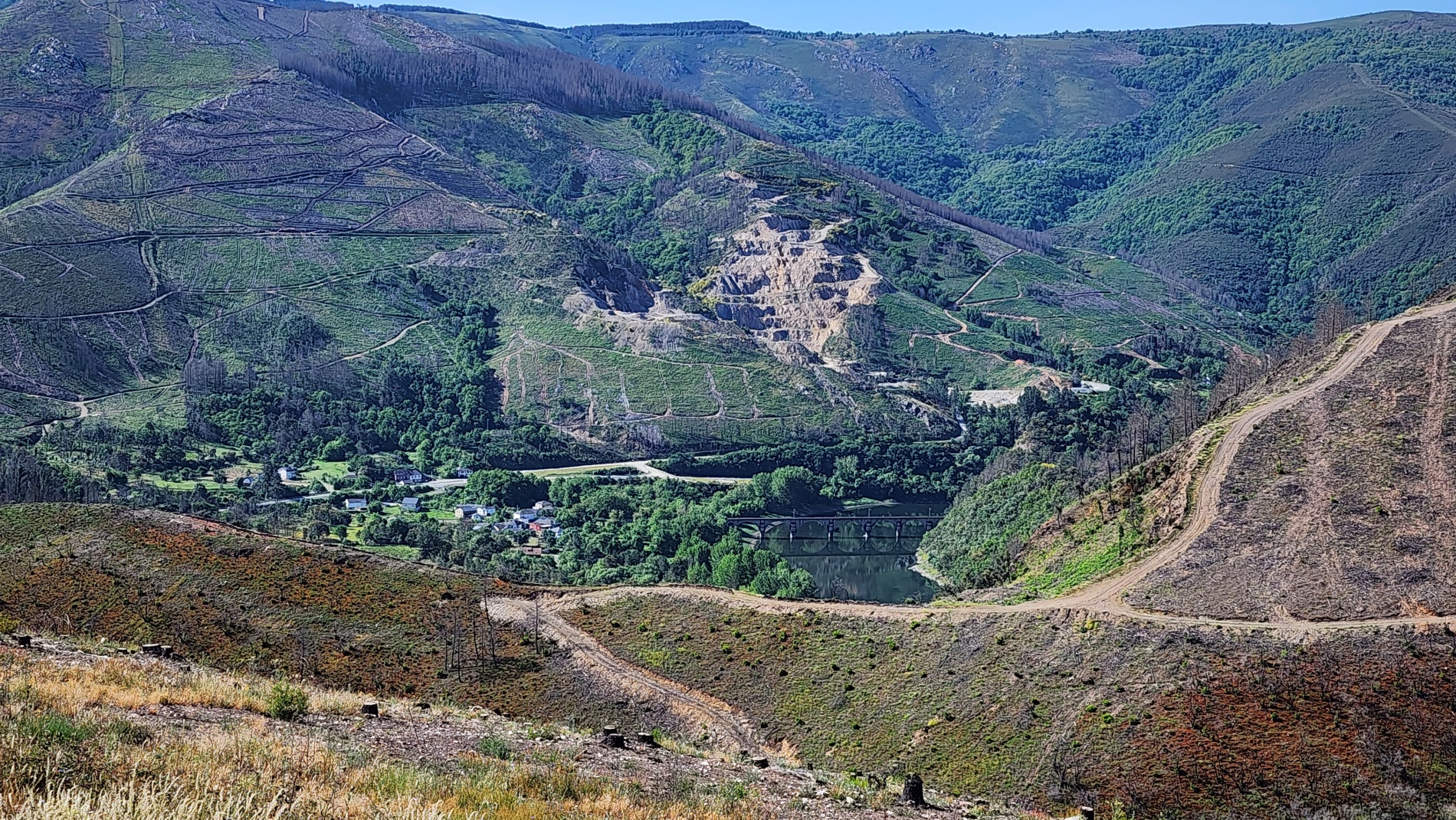 A striking mix of forestry and industry below the Camino: the Río Sil, Rairos railway bridge and quartzite quarry, seen from the climb towards A Labrada