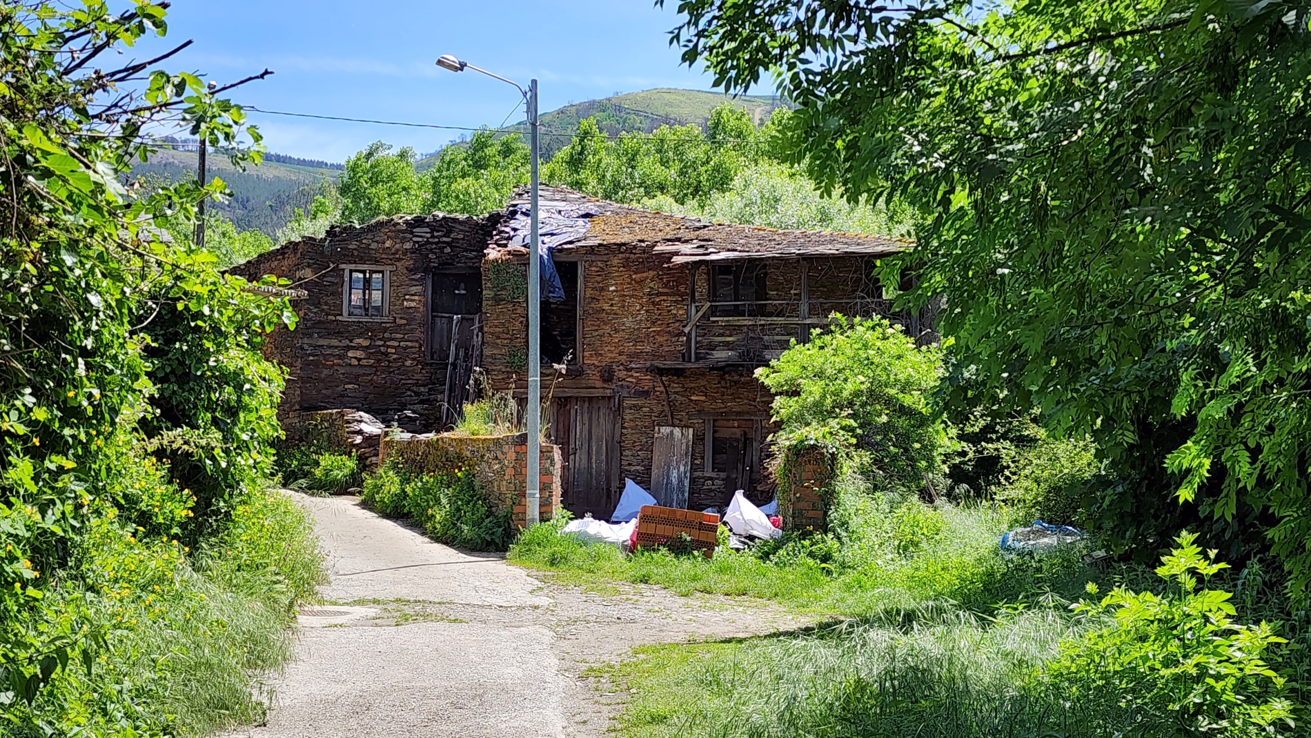 Old stone houses tucked among the greenery at A Labrada, my overnight stop at Pensión Pacita